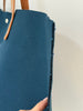 Navy canvas tote bag with leather handles and laminated lining
