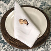 White 100% linen napkins with an two embroidered faces