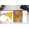 Marble and teak wood board, with a single letter etched monogram. 