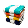 Beach Towels in a stack in colours Teal, Orange, Golden and Navy