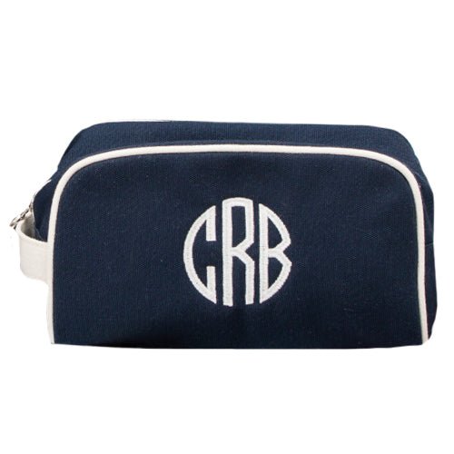 Navy Monogrammed Oakham Wash Bag with a large circle white monogram, made from Heavyweight cotton canvas with a water resistant lining - Initially London