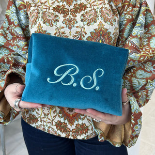 Monogrammed velvet wash bag made from teal blue cotton velvet
