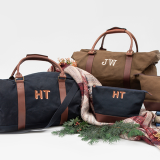 Collection of bags with monogram embroidery initials 'JW' and 'HT' on a white background