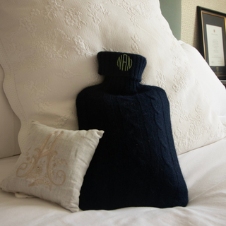 Navy blue hot water bottle with green monogram embroidered by initially London 