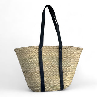 Palm leaf basket with flat leather navy blue straps and an embroidered monogram
