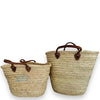 Covent Garden straw baskets embroidered with a monogram by initially London, shown in two sizes