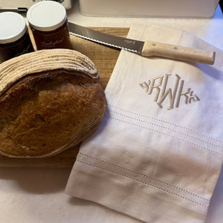 Monogrammed linen towel with punch spoke detail