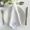 White Scallop Napkin Embroidered with a large traditional monogram in blue.