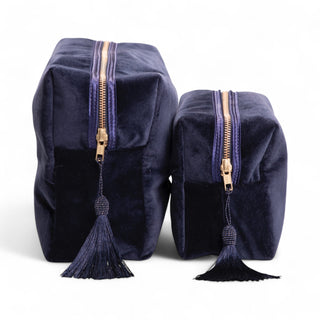 Side view of monogrammed navy velvet wash bags