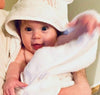 Baby wearing the baby bath towel