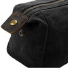 The side of a black coloured waxed canvas wash bag without a monogram