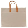 A natural cotton canvas tote bag, with leather handles without a monogram
