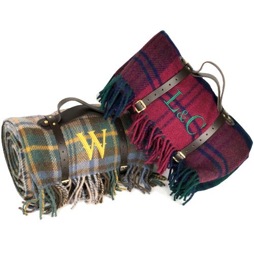 100% British wool with a nylon, water-resistant backing Picnic Rug in Red Check and Earthy Check. Both with large monograms 