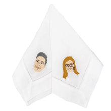 White 100% linen napkins with an embroidered man's face on one, and a Women's face on the other