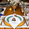A table setting with a white 100% linen napkin with Beyonce embroidered on it 