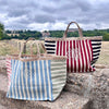 100% Organic Jute Striped Tote bags in white and Navy and Sherbet tones, with a large monogram at the front