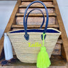 Market Basket which are handwoven in Morocco using palm leaves which are both strong and durable, the lining is 100% cotton dyed navy to match the straps. A neon monogram on the front