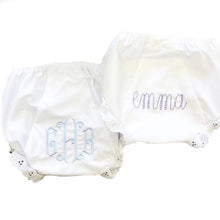 35% cotton batiste and 65% polyester Lacy Nappy Cover with large monograms on the back 