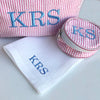 100% linen Ladies' Handkerchiefs (set of 2) with a tradition monogram in the right hand corner. Next to it is our pink St James wash bag and our mini bond jewellery case