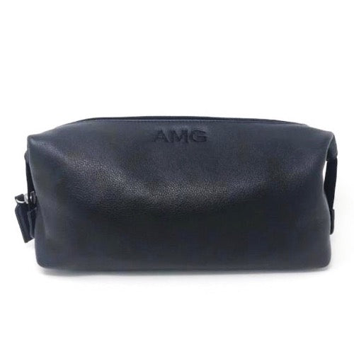 100% leather wash bag with a small three letter monogram at the top