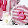 Pink Monogrammed Mini Bond Jewellery Case with lettering in two colour Shadow font in Candy Floss Pink and Red threads, made from 100% cotton seersucker, which has a thin stripey pattern - Initially London 