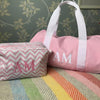 Pink Monogrammed Mini Chelsea Duffle with letting in Oklahoma font in White thread, made from durable HD polyester with a large two letter monogram