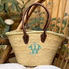 Shoulder Basket Handmade in northern Morocco from palm leaves from the doum plant. It is unlined and the leather handles are padded. Monogrammed with a traditional intertwined font.