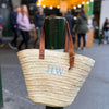 Monogrammed Maltby Market Basket with a three letter monogram in Schoolbook font in Dragonfly blue, made from finely woven palm leaves in Morocco - Initially London