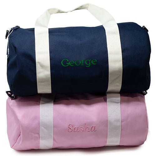 Pink and Navy Monogrammed Mini Chelsea Duffle made from durable HD polyester with webbing handles and a detachable shoulder strap, with one exterior zipped pocket - Initially London