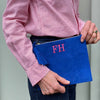 Majorelle Blue Monogrammed Soho Suede Pouch with pink initials, made from Suede with a brass zipper and suede tassel - Initially London
