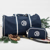 Navy Monogrammed Oakham Wash Bag with a large circle white monogram, made from Heavyweight cotton canvas with a water resistant lining - Initially London 