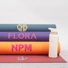 A collection of monogrammed Om Yoga Mats, made from phthalate-free PVC with no toxins. Each has a large monogram in various colours - Initially London