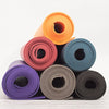 A collection of different coloured OM yoga mats, made from phthalate-free PVC with no toxins - Initially London