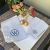 Monogrammed Navy Preppy Stripe Tea Towel with Blue motif, made from 50% cotton and 50% linen - Initially London 